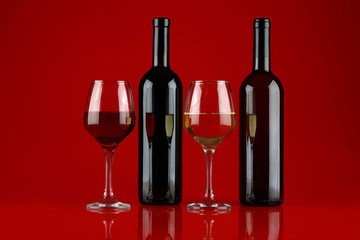 Still life with red and white wine on Burgundy background