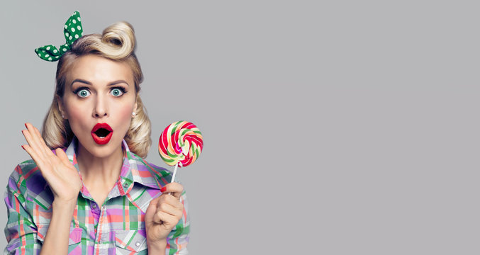 beautiful woman with lollipop, dressed in pin-up style