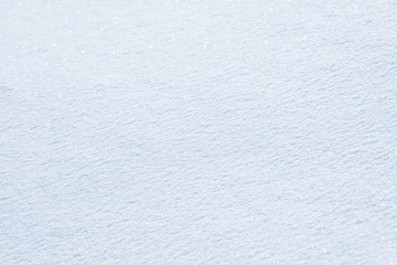 Fresh snow background texture. Winter background with snowflakes and snow mounds. Snow lumps.