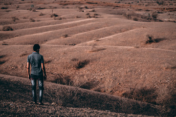 Man looking at arid landscape
