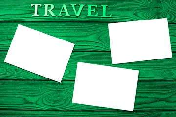 travel, clean sheets of photo paper on wooden background. tourism, photography.