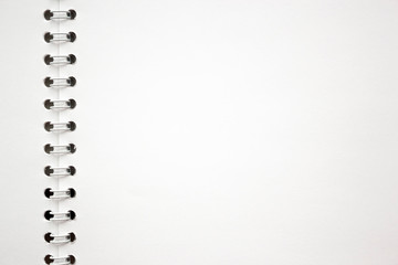 blank white album sheet texture with spiral binding. background