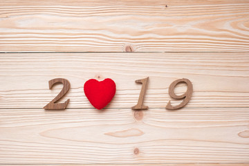 2019 number with red heart shape  on wooden background, health, Insurance and New Year New You concept
