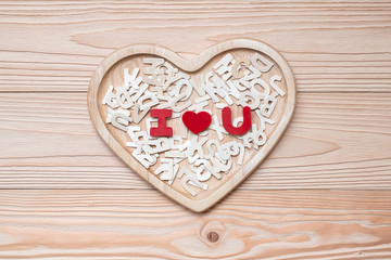 I Love U text on wooden table background. romantic and Valentine Day holiday Concept