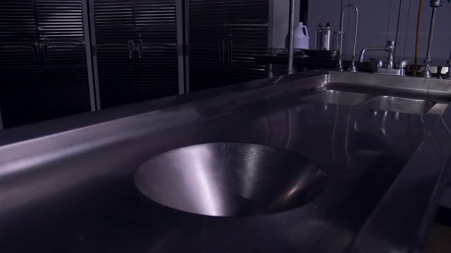 EMPTY AUTOPSY TABLE SLIDER SHOT IN 4K, 10 BIT, 4:2:2.