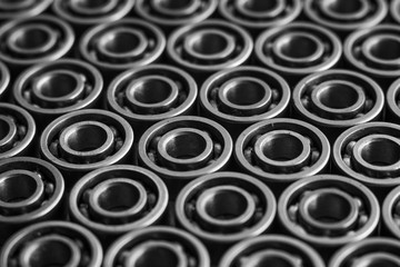 Machinery concept. Set of various gears and ball bearings old and new, BW, black and white, texture...