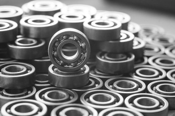 Machinery concept. Set of various gears and ball bearings old and new, BW, black and white