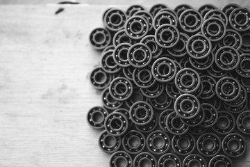 Machinery concept. Set of various gears and ball bearings old and new, BW, black and white, texture...