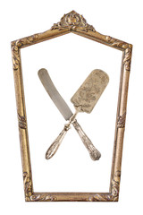 Fototapeta premium Vintage gilded pentagonal frame and crossed cake shovel and knife with an ornament isolated on white. Retro style.