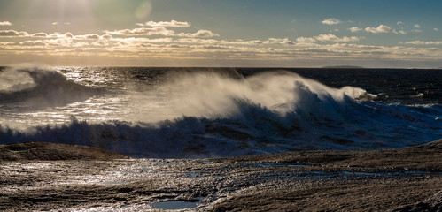 Winter waves at Peggy's Cove in Nova Scotia during sunset, peaceful, waves, powerful.