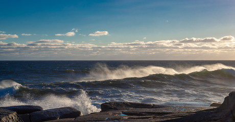 Winter waves at Peggy's Cove in Nova Scotia during sunset, peaceful, waves, powerful.