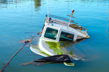 The boat drowned in the Mediterranean. Filled with water. Athens, Greece