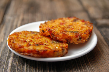 Crispy roasted vegetarian burger made from various type of vegetables on old wooden table