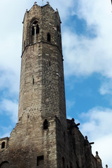 old stone tower against a cloudy sky