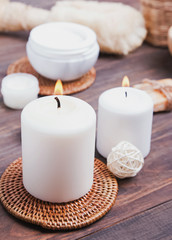 Candles, body care products and accessories on the white background