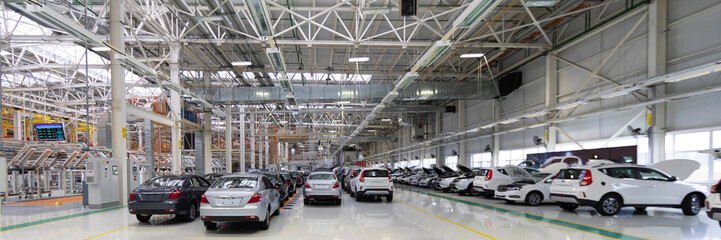 Automotive production line. Long format. Wide angle view of plant of automotive industry. Can be...