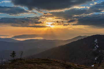 Beautiful sunrise in the Skole Beskydy with fantastic beauty over the sky, and the fog sea around the majestic Carpathian Mountains.