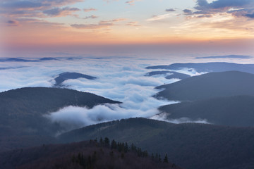 Beautiful sunrise in the Skole Beskydy with fantastic beauty over the sky, and the fog sea around the majestic Carpathian Mountains.