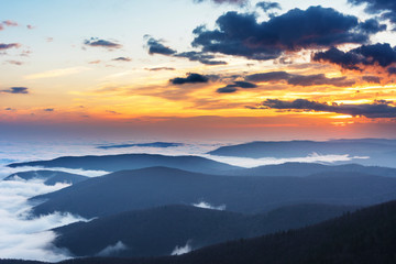 Fototapeta na wymiar Beautiful sunrise in the Skole Beskydy with fantastic beauty over the sky, and the fog sea around the majestic Carpathian Mountains.