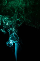 Green smoke on black background