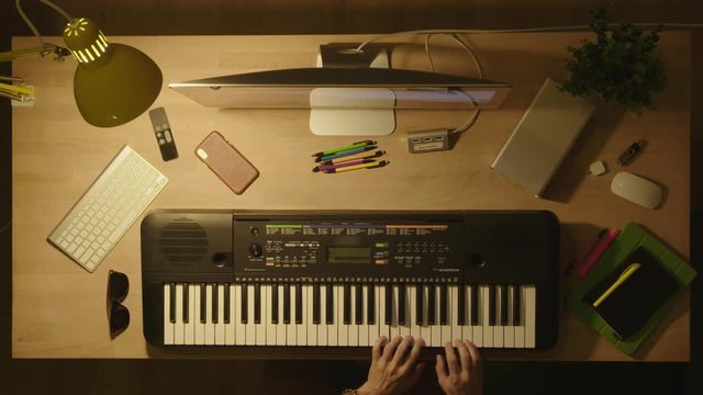 Playing piano/Synthesizer  / Creative workspace 