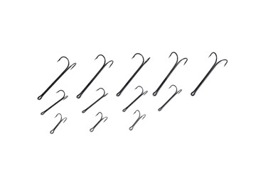 double hooks for fishing of various sizes on a white background close-up