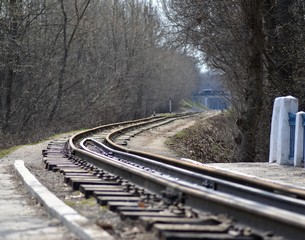 Fototapeta premium Railway in the forest in early spring