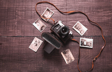 Old vintage camera with a leather case and old photos