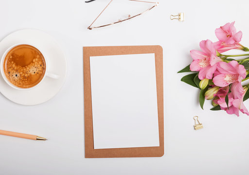 Creative composition with coffee and flowers, top view.