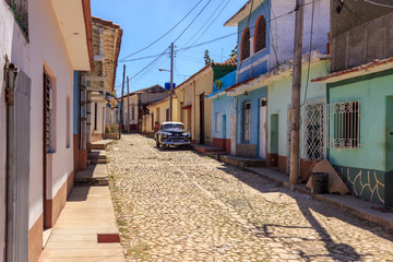 Old car in an old street in Trinidad - Cuba