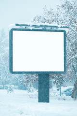 Empty billboard poster advertising mock up on snowy street