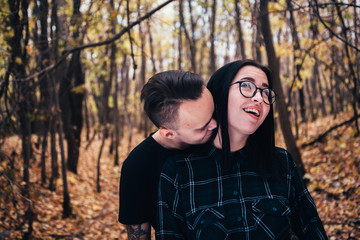 Fototapeta premium young man and woman in the autumn forest