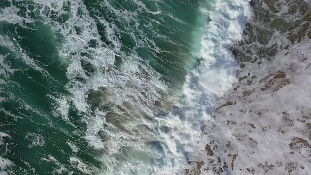 West Portugal aerial top view over Atlantic coastline ocean waves reachin Odeceixe beach