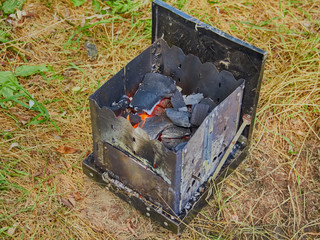 Hiking tourist stove with fuel from wood chips