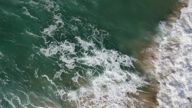 West Portugal aerial top view over Atlantic coastline ocean waves reachin Odeceixe beach