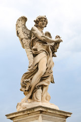 Fototapeta na wymiar Angel with the Crown of Thorns Statue in Hadrian Bridge, Rome, Italy