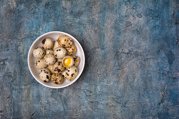 Top view on small quail eggs in white bowl