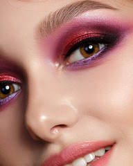 Closeup portrait of young beautiful woman with bright pink smokey eyes and lips. Fashion makeup. Studio shot. Modern summer make up - obrazy, fototapety, plakaty