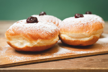 Food for hanukkah is jelly doughnuts with sugar powder.