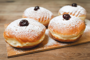 Food for hanukkah is jelly doughnuts with sugar powder.