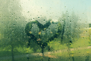 love card / a heart drawn on the rainy window