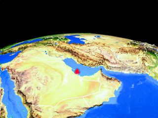 Qatar on model of planet Earth with country borders and very detailed planet surface.