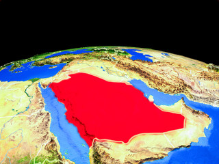 Saudi Arabia on model of planet Earth with country borders and very detailed planet surface.