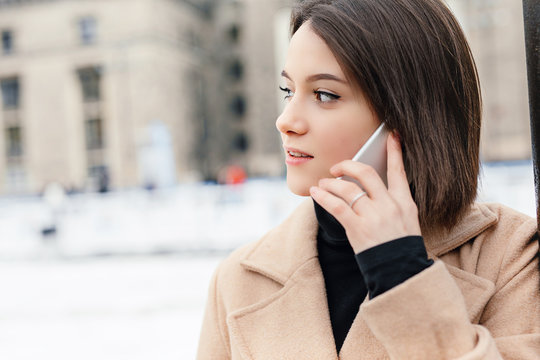 Woman Talking On Phone Walking On The Street. Portrait Of Stylish Smiling Business Woman In Winter Clothes Calling On Mobile Phone. Female Winter Style. - Image