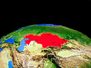 Kazakhstan on model of planet Earth with country borders and very detailed planet surface.