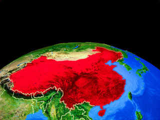 China on model of planet Earth with country borders and very detailed planet surface.