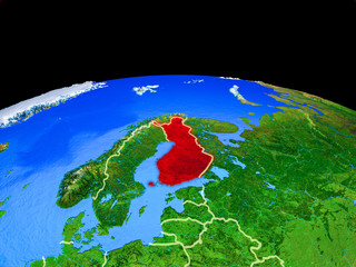 Finland on model of planet Earth with country borders and very detailed planet surface.