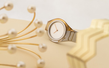 Golden and silver wrist watch and bracelets