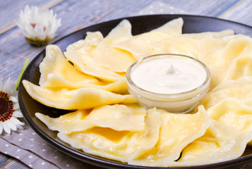 Dumplings, filled with cottage cheese (farmer cheese). Varenyky, vareniki, pierogi, pyrohy. ...