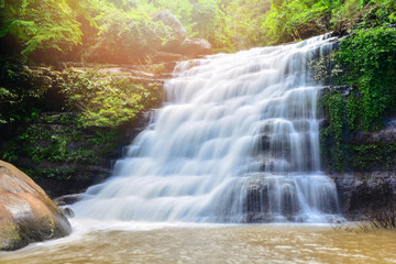 Obraz premium Waterfall in the nature rain jungle forest in the rainy season / Waterfall at Loei Thailand